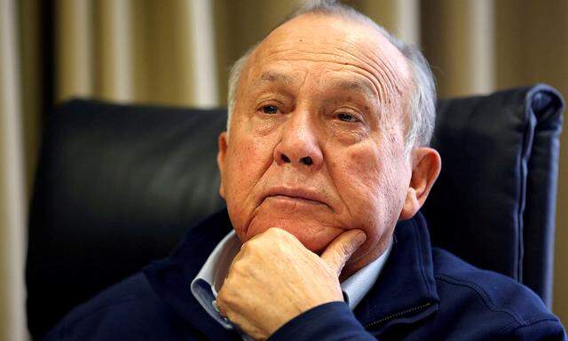 FILE PHOTO: South African magnate Christo Wiese, Steinhoff´s largest shareholder and chairman, listens during an interview in Cape Town