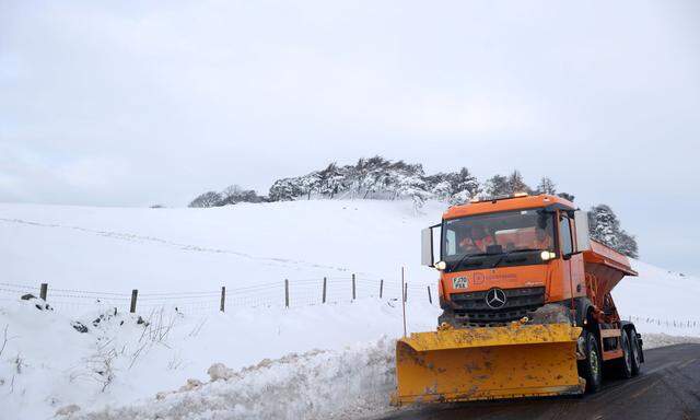 Snow plough clears the A53 road between Leek and Buxton after Storm Arwen