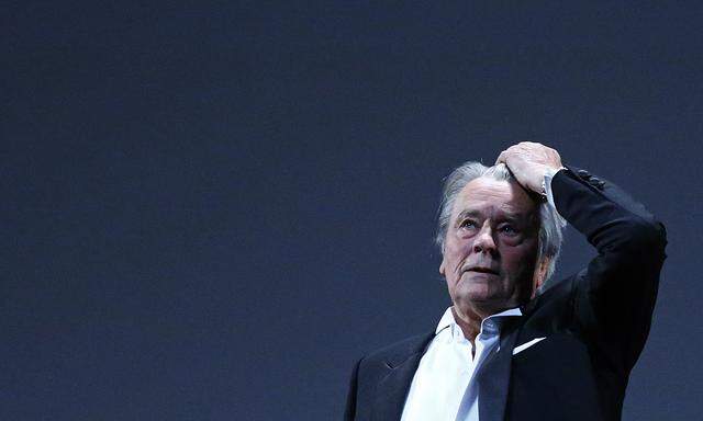 Actor Alain Delon reacts on stage during a tribute for his career before the screening of the restored print of the film ´Plein Soleil´ by Rene Clement during the 66th Cannes Film Festival