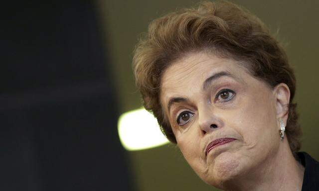 Rousseff reacts during a news conference in Brasilia