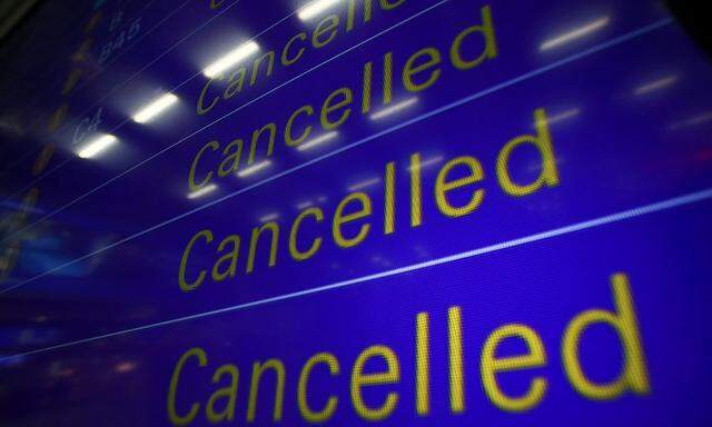 An electronic information board displays cancelled flights at Frankfurt airport