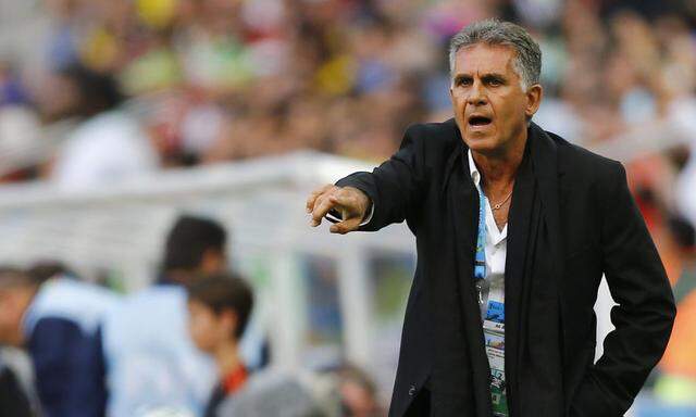 Iran's coach Carlos Queiroz gestures during the 2014 World Cup Group F soccer match between Iran and Nigeria at the Baixada arena