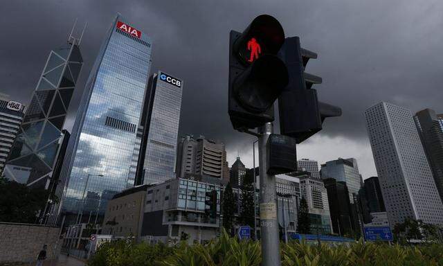 A traffic light is seen at the financial Central district in Hong Kong