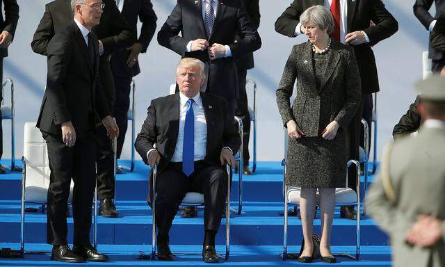 NATO Secretary General Jens Stolenberg, U.S. President Donald Trump and Britain´s Prime Minister Theresa May attend a ceremony at the new NATO headquarters before the start of a summit in Brussels