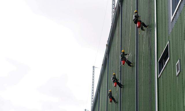 Employees work at a converter station during a comprehensive maintenance in Wuzhong