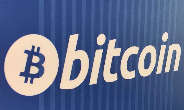 FILE PHOTO: A Bitcoin logo is seen on a cryptocurrency ATM in Santa Monica