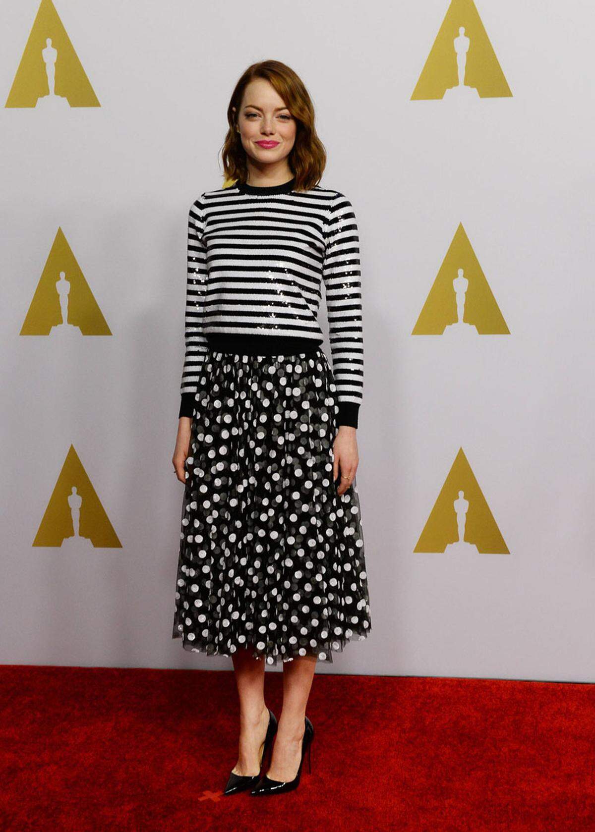 Schauspielerin Emma Stone funkelte den Fotografen in Streifen und Punkten von Michael Kors entgegen. Sie ist als beste Nebendarstellerin im Film "Birdman" nominiert.