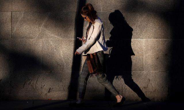 The Wider Image: Phones and the city