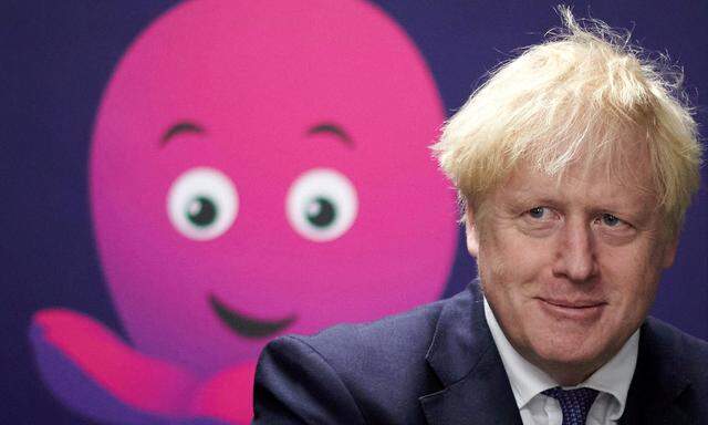 FILE PHOTO: Britain's PM Boris Johnson visits Octopus Energy, in London