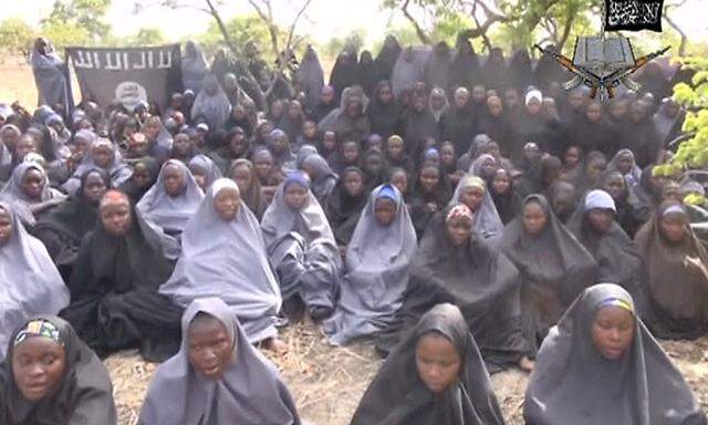 Kidnapped schoolgirls are seen at an unknown location in this still image taken from an undated video released by Boko Haram