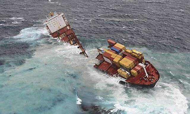 The stricken container ship Rena sits on a reef after it separated into two on the east coast of New 