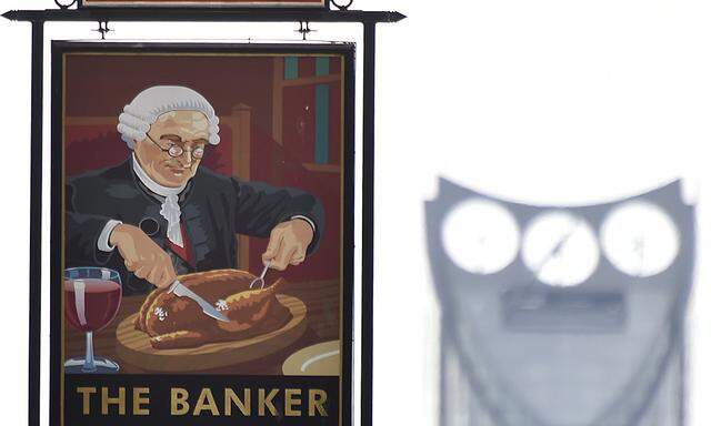 A painted sign for a public house named ´The Banker´ is seen in the City of London