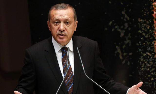 Turkey´s Prime Minister Tayyip Erdogan addresses members of his ruling AK Party (AKP) during a meeting at the party headquarters in Ankara