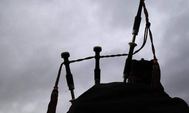 A competitor takes part in the annual World Pipe Band Championships at Glasgow Green, Scotland