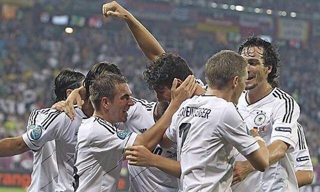 Germany's Gomez celebrates his goal against Portugal with teammates during their Group B Euro 2012 so
