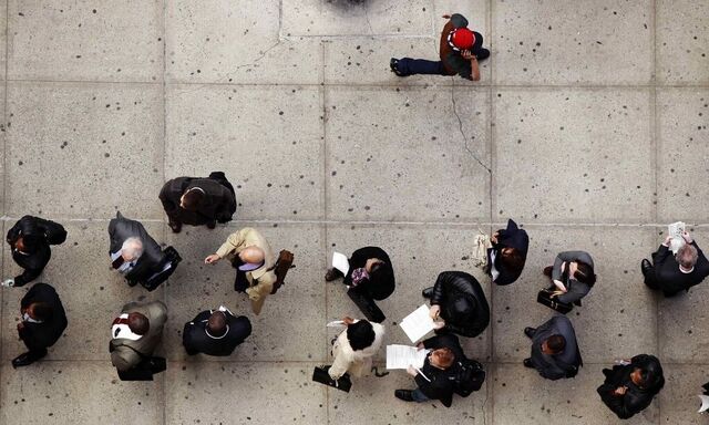 Job seekers stand in line to attend the Dr. Martin Luther King Jr. career fair held by the New York State department of Labor in New York