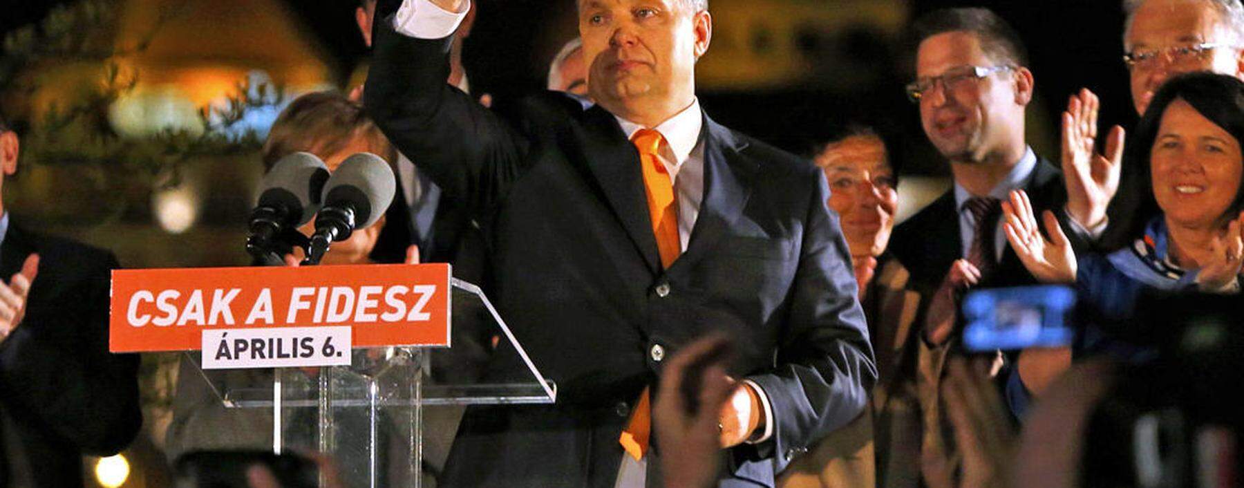 Hungary´s PM Orban waves hand as he addresses to supporters after partial results of parliamentary elections are announced in Budapest