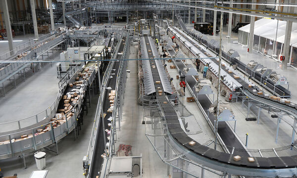 FILE PHOTO: United Parcel Service employees work at the new package sorting and delivery UPS hub in Corbeil-Essonnes and Evry