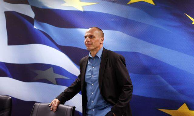Greek Finance Minister Varoufakis looks on before a common press conference with Dijsselbloem head of the euro zone finance ministers´ group at the ministry in Athens