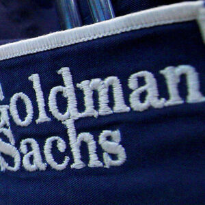 The logo of Dow Jones Industrial Average stock market index listed company Goldman Sachs (GS) is seen on the clothing of a trader working at the Goldman Sachs stall on the floor of the New York Stock Exchange