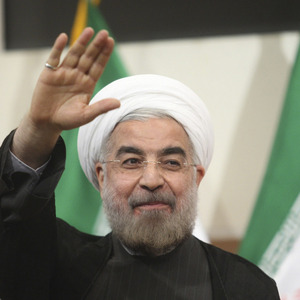 Iranian President-elect Hassan Rohani gestures to the media during a news conference in Tehran