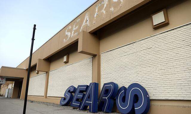 A dismantled sign sits leaning outside a Sears department store in Nanuet