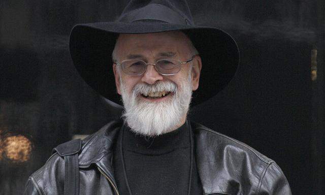 British author Terry Pratchett poses for a photograph while holding a petition on the behalf of the Alzheimer´s Research Trust at the front door of 10 Downing Street in London.