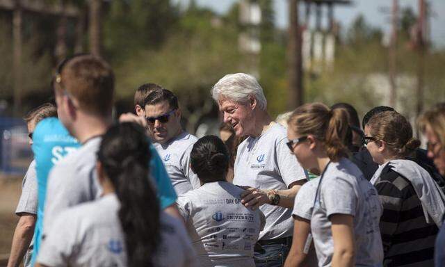 Former U.S. President Clinton speaks to volunteers on the final day of the 2014 Clinton Global Initiative University Meeting in Phoenix