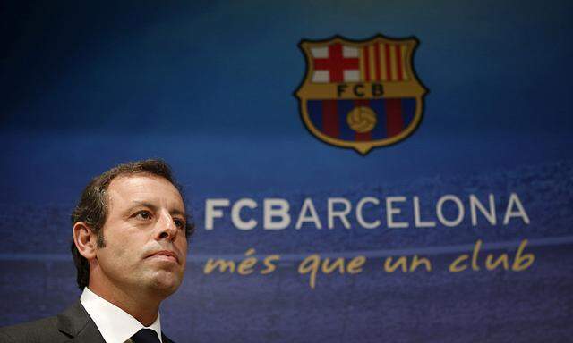 Barcelona president Sandro Rosell arrives for a news conference where he announced his resignation at Camp Nou stadium in Barcelona