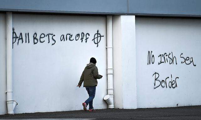 FILE PHOTO: Loyalist graffiti seen with messages against the Brexit border checks in relation to the Northern Ireland protocol at the harbour in Larne