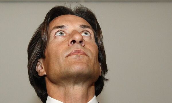 Former Austrian Finance Minister Grasser waits at court in Vienna