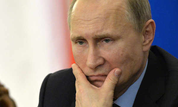 Russian President Vladimir Putin looks on during a meeting with Cyprus President Nicos Anastasiades at the Novo-Ogaryovo state residence outside Moscow