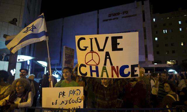 Left-wing Israeli protesters participate in a demonstration against the recent rise in Palestinian-Israeli violence in Jerusalem