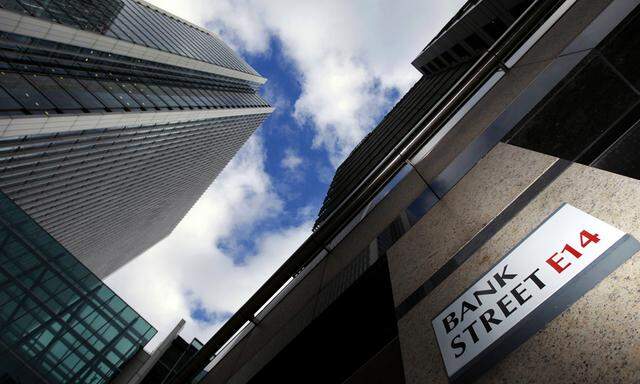 File photo of a sign for Bank Street and high rise offices in the financial district Canary Wharf in London