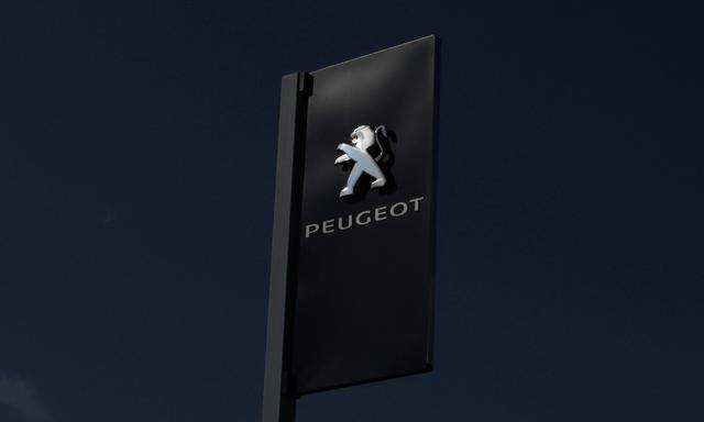 The logo of French car maker Peugeot is seen at a dealership in Nice