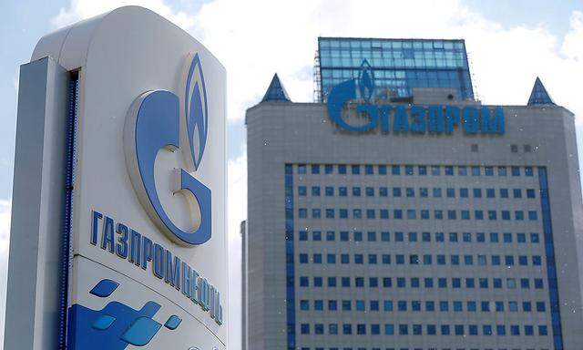 Board with Gazprom Neft oil company logo is seen at a fuel station in Moscow