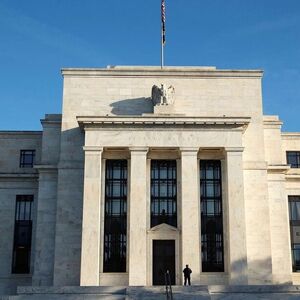 A police officer keeps watch in front of the U.S. Federal Reserve in Washington