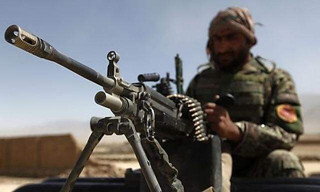 Afghan National Army soldier keeps watch near the site of an incident in Kabul