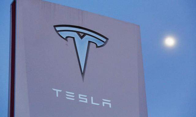 Signage is displayed outside of Tesla Motors before the Tesla Energy Powerwall Home Battery event in Hawthorne, California