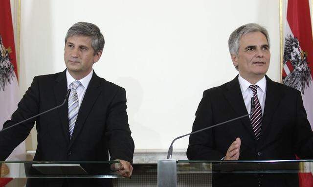 Austrian Chancellor Faymann of the SPOe and Vice Chancellor Spindelegger of the OeVP address a news conference after a cabinet meeting in Vienna