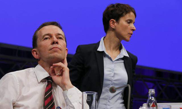 Lucke founder and co-chairman of AfD sits next to AfD co-chairman Petry during party congress in Essen