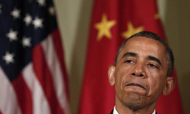 U.S. President Obama listens to a response from Chinese President Xi at The Annenberg Retreat in Rancho Mirage