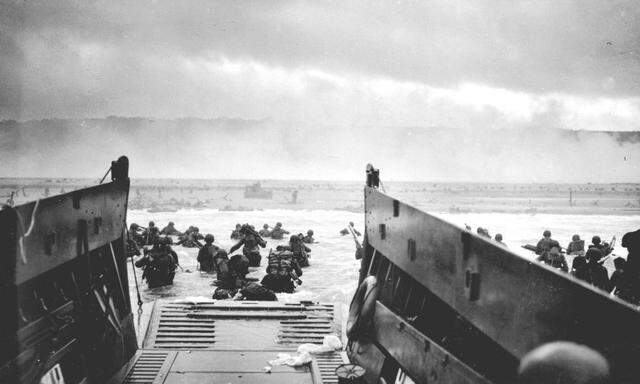 Handout photo of U.S. troops wading ashore from a Coast Guard landing craft at Omaha Beach during the Normandy D-Day landings near Vierville sur Mer