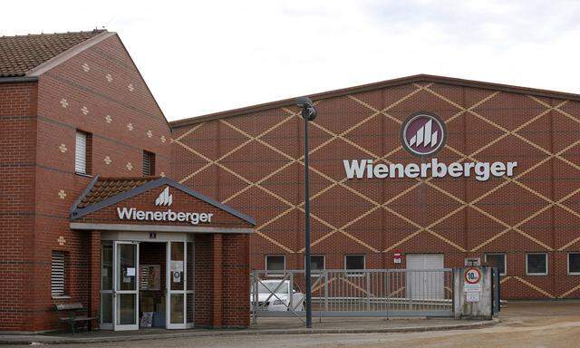 Logos of Wienerberger, the world´s biggest brickmaker, are pictured at its headquarters in Hennersdorf