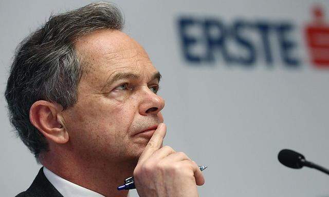 Treichl, CEO of Austrian lender Erste Group, listens during a news conference in Vienna