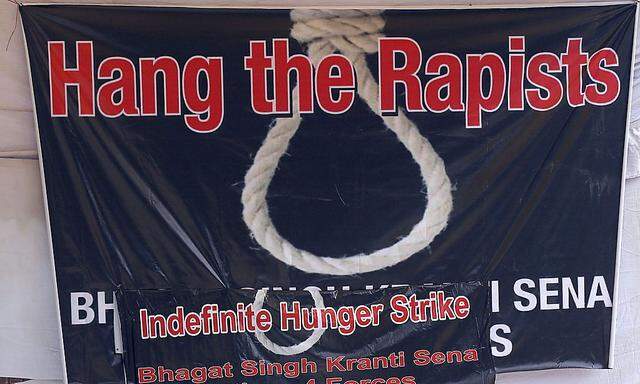 Ein Protest-Banner, das für einen Vergewaltiger Wirklichkeit wird, sollte ihn der Präsident nicht begnadigen.