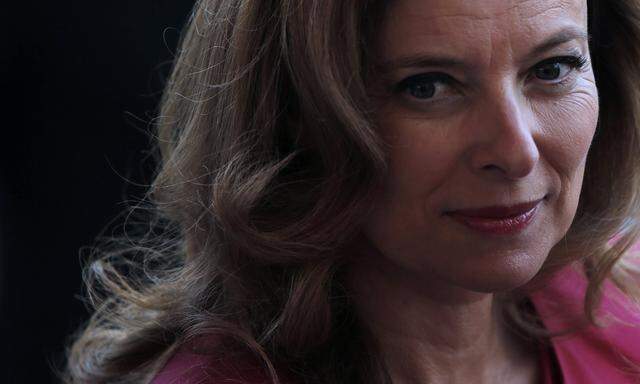 File picture of Valerie Trierweiler, former companion of French President Francois Hollande, attending the traditional Bastille day military parade on the Champs Elysee in Paris