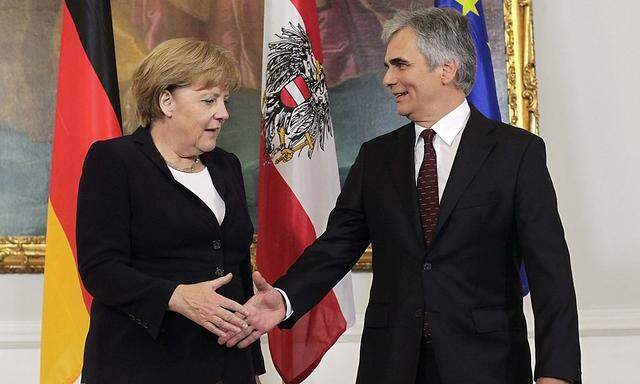 Austrian Chancellor Faymann welcomes German Chancellor Merkel in Vienna