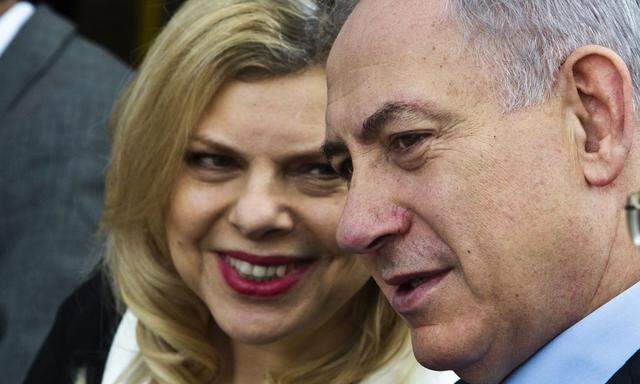 Israeli Prime Minister Benjamin Netanyahu and his wife Sara attend a reinterment ceremony north of Netanya