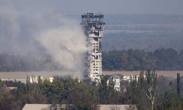 A Ukrainian national flag flies in the traffic control tower of the Donetsk Sergey Prokofiev International Airport hit by shelling during fighting between pro-Russian rebels and Ukrainian government forces in Donetsk